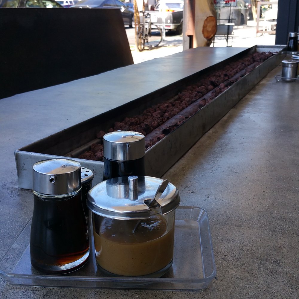 Underbelly - Large tables. Entrance in background - Ramen Near Me - San Diego, California Underbelly - Large tables. Entrance in background - Ramen Near Me - San Diego, California