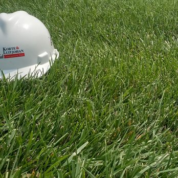 Korte & Luitjohan Contractors - a hard hat in the grass - General Contractors Near Me - Highland, Illinois