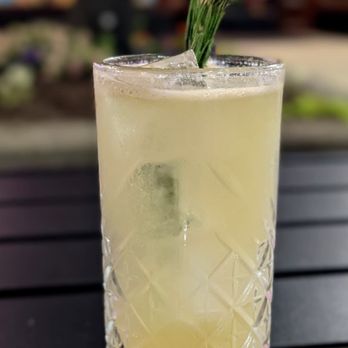 Nightcap - a glass of lemonade with a sprig of rosemary - Cocktail Bars Near Me - Ann Arbor, Michigan Nightcap - a glass of lemonade with a sprig of rosemary - Cocktail Bars Near Me - Ann Arbor, Michigan