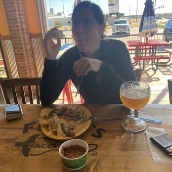 Fuzzy's Taco Shop - Nachos and a look outside - Bars Near Me - Hays, Kansas