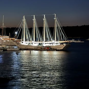 Bar Harbor Inn - A ship in Bar Harbor bay at night. - Hotels Near Me - Bar Harbor, Maine