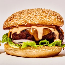 a hamburger with cheese and lettuce a hamburger with cheese and lettuce