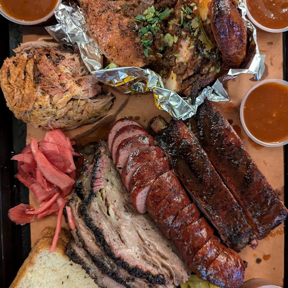 Southern Junction - Texas Trinity & 2 Meats. 1/3 lb each of Brisket, Sausage, Ribs & our choice of Pulled Pork, Half Dip Dip Chicken. - Indian Near Me - Buffalo, New York Southern Junction - Texas Trinity & 2 Meats. 1/3 lb each of Brisket, Sausage, Ribs & our choice of Pulled Pork, Half Dip Dip Chicken. - Indian Near Me - Buffalo, New York