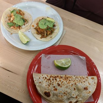 Tacos Chukis - Quesadilla in the front and house & chicken taco in the back. - Tacos Near Me - Seattle, Washington Tacos Chukis - Quesadilla in the front and house & chicken taco in the back. - Tacos Near Me - Seattle, Washington