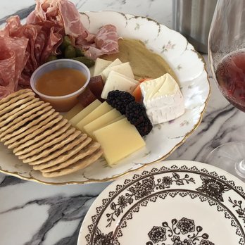Jardin - Chef's choice charcuterie plate to accompany a chilled Primitivo from Puglia. Lovely. - Wine Bars Near Me - Richmond, Virginia