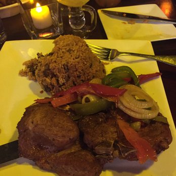 Vejigantes - Pork chop dinner with arroz y gandules and a side of maduras. - Puerto Rican Near Me - Boston, Massachusetts Vejigantes - Pork chop dinner with arroz y gandules and a side of maduras. - Puerto Rican Near Me - Boston, Massachusetts