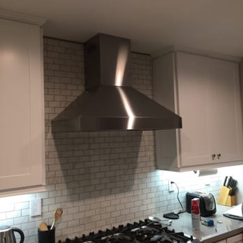 Improve My Kitchen - Final pick of backsplash with hood installed. - General Contractors Near Me