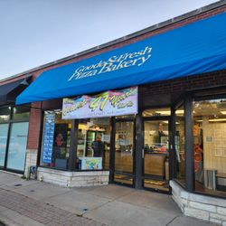 Goode & Fresh Pizza Bakery - Outside the shop with celebration banner!
