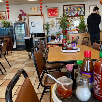Asian Bistro - a table with condiments and condiments - Vietnamese Near Me - Wichita, Kansas