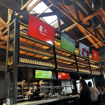 Shelter Distilling - Full line of spirits above the indoor bar - Cocktail Bars Near Me - Dana Point, California
