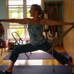 Hilo Yoga - Teacher demonstrates proper alignment using wall rope. Intention, breath, light equals JOY!