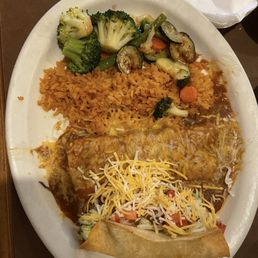 Two item combo plate: shredded pork enchilada, shredded chicken taco, rice, and grilled vegetables Two item combo plate: shredded pork enchilada, shredded chicken taco, rice, and grilled vegetables