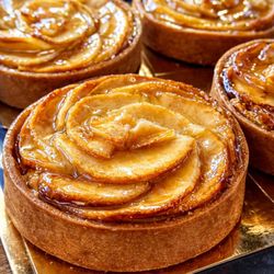 A classic apple tart with buttery pastry and a beautifully baked fruit topping.