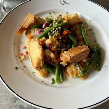 Bluebird - Really well cooked trout with hazelnuts and green beans. Comically large croutons but overall a great dish - French Near Me - Chapel Hill, North Carolina