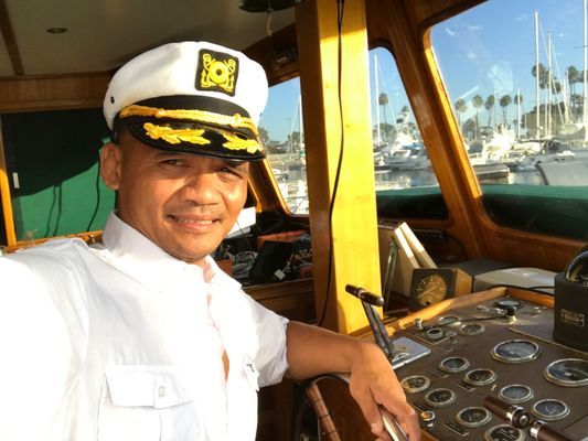 Meet Captain Ralph - As a certified US Coast Guard Boat Captain and over 20 years of boating experience, Safety is my top priority. I feel blessed to enjoy the breathtaking ocean on a 43 foot trawler boat and would love to share this experience with others.

​I am a Boeing Aerospace Engineer,  US Army Officer, Fixed Wing/Rotorcraft Pilot, and Surf Instructor.  Formerly known as the "Flying Filipino" (click here) . . .  Transformed into the "Floating Filipino".

Although I have many Credentials and Accomplishments, my strongest attribute is connecting with people and my sense of humor.

I may not be the sharpest tool in the shed but I never quit.   For example, my 4 year Engineering Degree from Cal Poly was the BEST 10 years of my life! My Masters in Aeronautical Science from Embry Riddle taught me that a Masters in Kung-Fu would have been a better choice. . . Oh well... Too late now . . .   Let's chase some dolphins and have and some fun!