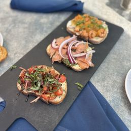 Bruschetta trio 1. Balsamic tomatoes 2. Smoked salmon 3. Blackened shrimp Bruschetta trio 1. Balsamic tomatoes 2. Smoked salmon 3. Blackened shrimp