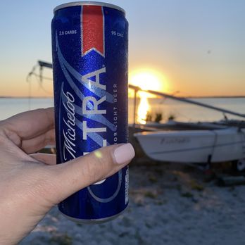 High & Dry Grill - Sunset view from High and Dry tables in the sand - Tiki Bars Near Me - Dunedin, Florida High & Dry Grill - Sunset view from High and Dry tables in the sand - Tiki Bars Near Me - Dunedin, Florida