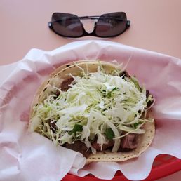 Photo of Tacos Moreno - Santa Cruz, CA, United States. Lengua taco was missing salsa and tomato. I'm told this is normally how lengua is served. If you ask for tomato, they'll serve it!