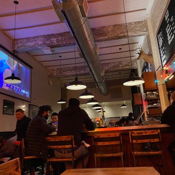 Pie Punks - people sitting at tables in a restaurant - Pizza Near Me - San Francisco, California Pie Punks - people sitting at tables in a restaurant - Pizza Near Me - San Francisco, California