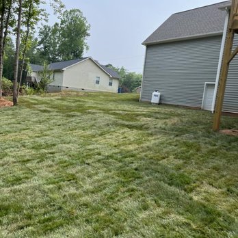 Mow-Town Landscaping - a yard with a lawn mower - Landscaping Near Me Mow-Town Landscaping - a yard with a lawn mower - Landscaping Near Me