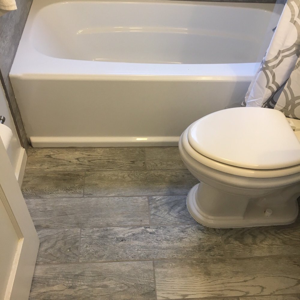 Zelaya Properties - Flooring matches the walls in the shower surround - General Contractors Near Me - Alexandria, Virginia Zelaya Properties - Flooring matches the walls in the shower surround - General Contractors Near Me - Alexandria, Virginia