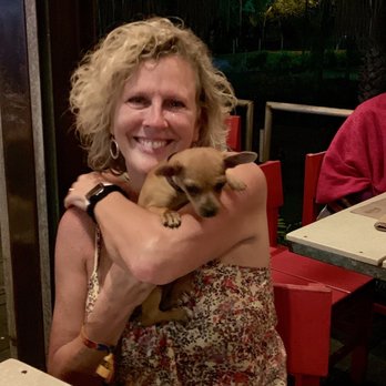 El Barracuda - Wife holding the young puppy of one of their patrons. - Seafood Near Me - Nuevo Vallarta, NAY El Barracuda - Wife holding the young puppy of one of their patrons. - Seafood Near Me - Nuevo Vallarta, NAY