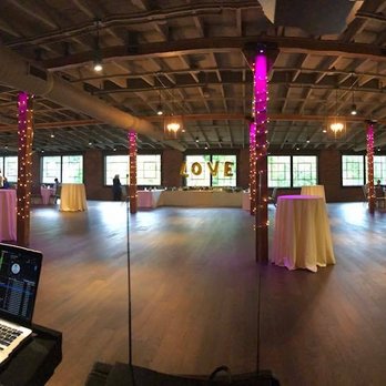 Mac Events - a large open room with a laptop on the table - DJs Near Me Mac Events - a large open room with a laptop on the table - DJs Near Me