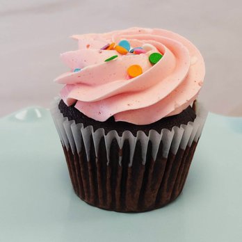 Plum Blossom Bakery - a chocolate cupcake with pink frosting and sprinkles - Bakeries Near Me - New York, New York Plum Blossom Bakery - a chocolate cupcake with pink frosting and sprinkles - Bakeries Near Me - New York, New York