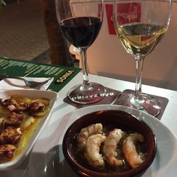 Bar Zafiro - House wine (DOP), prawns in garlic, and octopus. €2.50 each