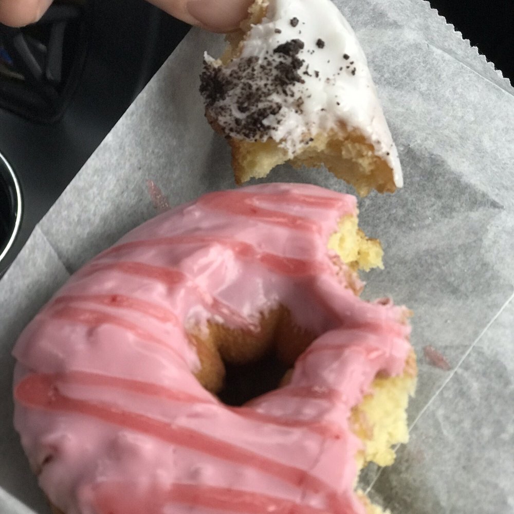 Mountain Donuts - Strawberry with strawberry glaze.. little piece of my husbands "sandwich" donut he had left - Donuts Near Me - South Ogden, Utah