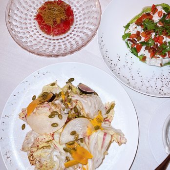 Monterey - two plates of food on a table - New American Near Me - New York, New York Monterey - two plates of food on a table - New American Near Me - New York, New York
