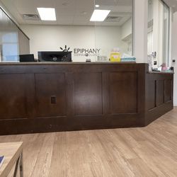 Epiphany Dermatology - Patient waiting room and reception desk.