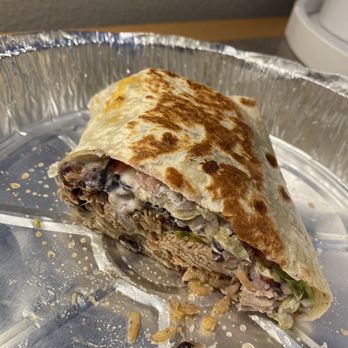 Grande Mexico - a half eaten burrito on a silver plate - Mexican Near Me - Amesbury, Massachusetts Grande Mexico - a half eaten burrito on a silver plate - Mexican Near Me - Amesbury, Massachusetts