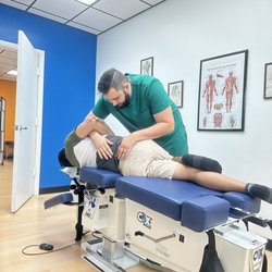 The Las Vegas Chiropractor - Dr.Marino doing treatment with my friend from Jacksonville FL.