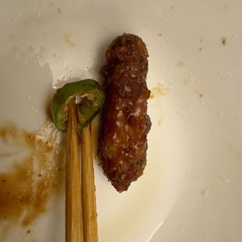 bb.q Chicken Cincinnati - Tiny wing next to chopsticks - Korean Near Me - Cincinnati, Ohio