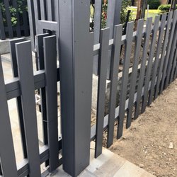 Northgates In Motion - Metal fabricated rolling mechanical drive gate with redwood stained cladding