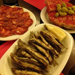 La Bóveda - Chorizo, little fried fish, bread with tomatoes and olives.
