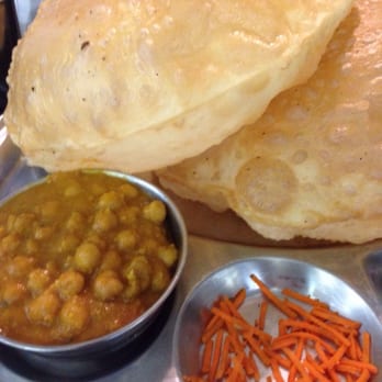 Madras Cafe - Chole Bhattura massive fried breads (Bhattura) with spiced garbanzo beans (chole). Really tasty but really oily! - Indian Near Me - Sunnyvale, California Madras Cafe - Chole Bhattura massive fried breads (Bhattura) with spiced garbanzo beans (chole). Really tasty but really oily! - Indian Near Me - Sunnyvale, California