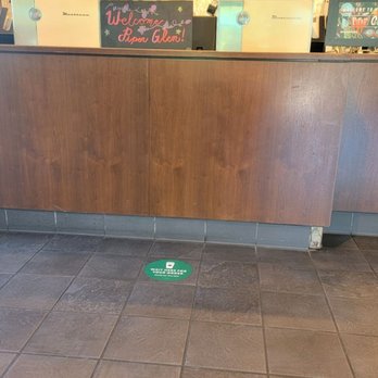 Starbucks - a cup of coffee on the floor of a coffee shop - Coffee & Tea Near Me - Charlotte, North Carolina