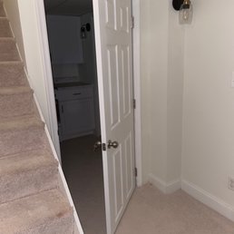 Wall and door separating the basement unit. Wall and door separating the basement unit.