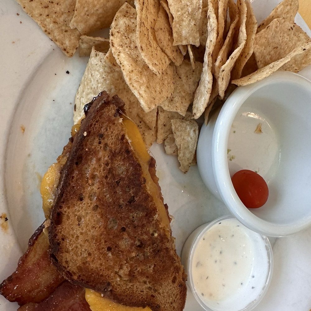 Fig, Gouda, Bacon Sandwich on gluten free bread with a side of tortilla chips. It was delicious! Fig, Gouda, Bacon Sandwich on gluten free bread with a side of tortilla chips. It was delicious!