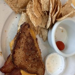 Fig, Gouda, Bacon Sandwich on gluten free bread with a side of tortilla chips. It was delicious! Fig, Gouda, Bacon Sandwich on gluten free bread with a side of tortilla chips. It was delicious!