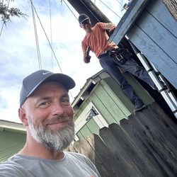 Fix-it Alex - Up on the job with my teammate -- safe, solid, and smiling.