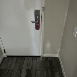 Door has a gap you can almost see the hallway through it. Door has a gap you can almost see the hallway through it.