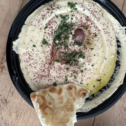 Creamy hummus with fresh hot pita. Creamy hummus with fresh hot pita.