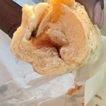 Subway - a hand holding a sandwich with a bite taken out of it - Sandwiches Near Me - Madras, Oregon