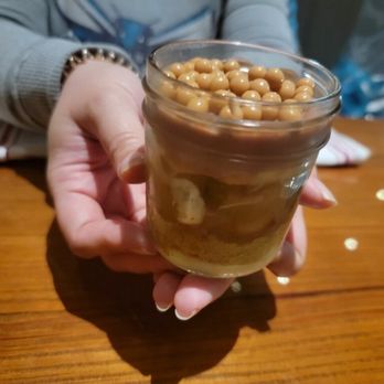 Angeline's - Panna cotta with cake layer, pear and caramel crunchy topping - Italian Near Me - Charlotte, North Carolina Angeline's - Panna cotta with cake layer, pear and caramel crunchy topping - Italian Near Me - Charlotte, North Carolina