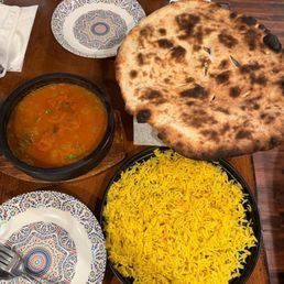 Chicken vegetable stew with bread and rice