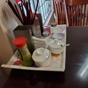 Pho Abbotsford #1 - a table with dishes and utensils on it - Vietnamese Near Me - Abbotsford, British Columbia Pho Abbotsford #1 - a table with dishes and utensils on it - Vietnamese Near Me - Abbotsford, British Columbia