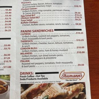 Theresa's  Cafe - Menu - The menu from Theresa's Cafe in Flemington, NJ, displays a selection of sandwiches, salads, and beverages. Sandwich options include Caprese, Chicken Caesar, Cordon Bleu, Milanese, and Italian, with prices ranging from $9.50 to $10.25. Salad choices include Egg Salad BLT, Chicken Salad BLT, Tuna Salad, and Buffalo Chicken, priced between $9.25 and $10.75. Drinks offered are fresh coffee, hot tea, and soda products. The menu emphasizes made-to-order meals and includes a photo of a sandwich at the bottom. - Delis Near Me - Flemington, New Jersey